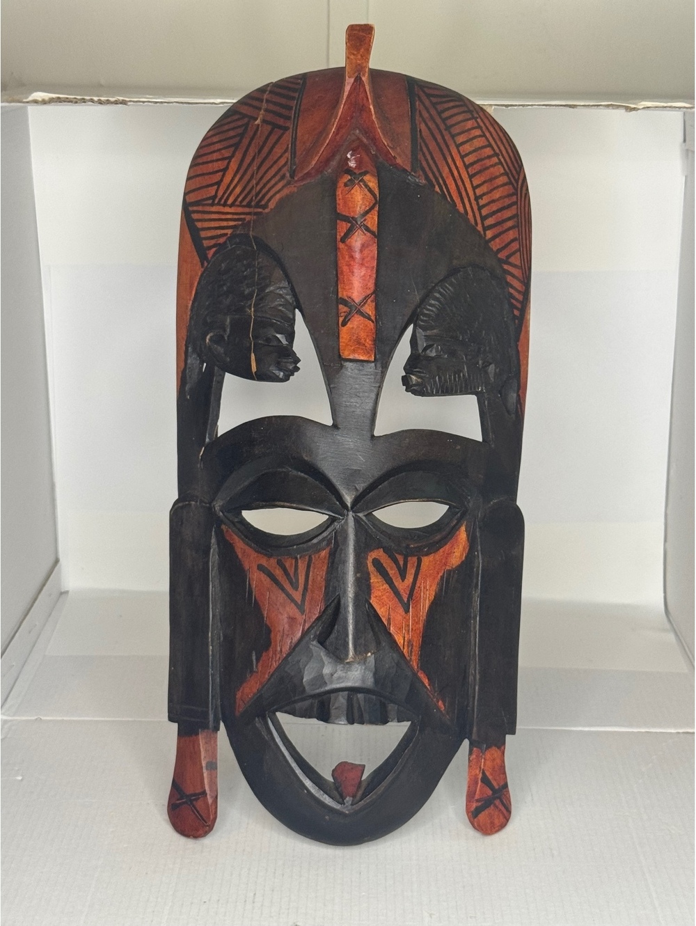 Carved wooden wall mask